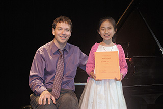 Piano Studio Gallery:  JENNIFER LIU with her teacher, pianist YEVGENY MOROZOV.